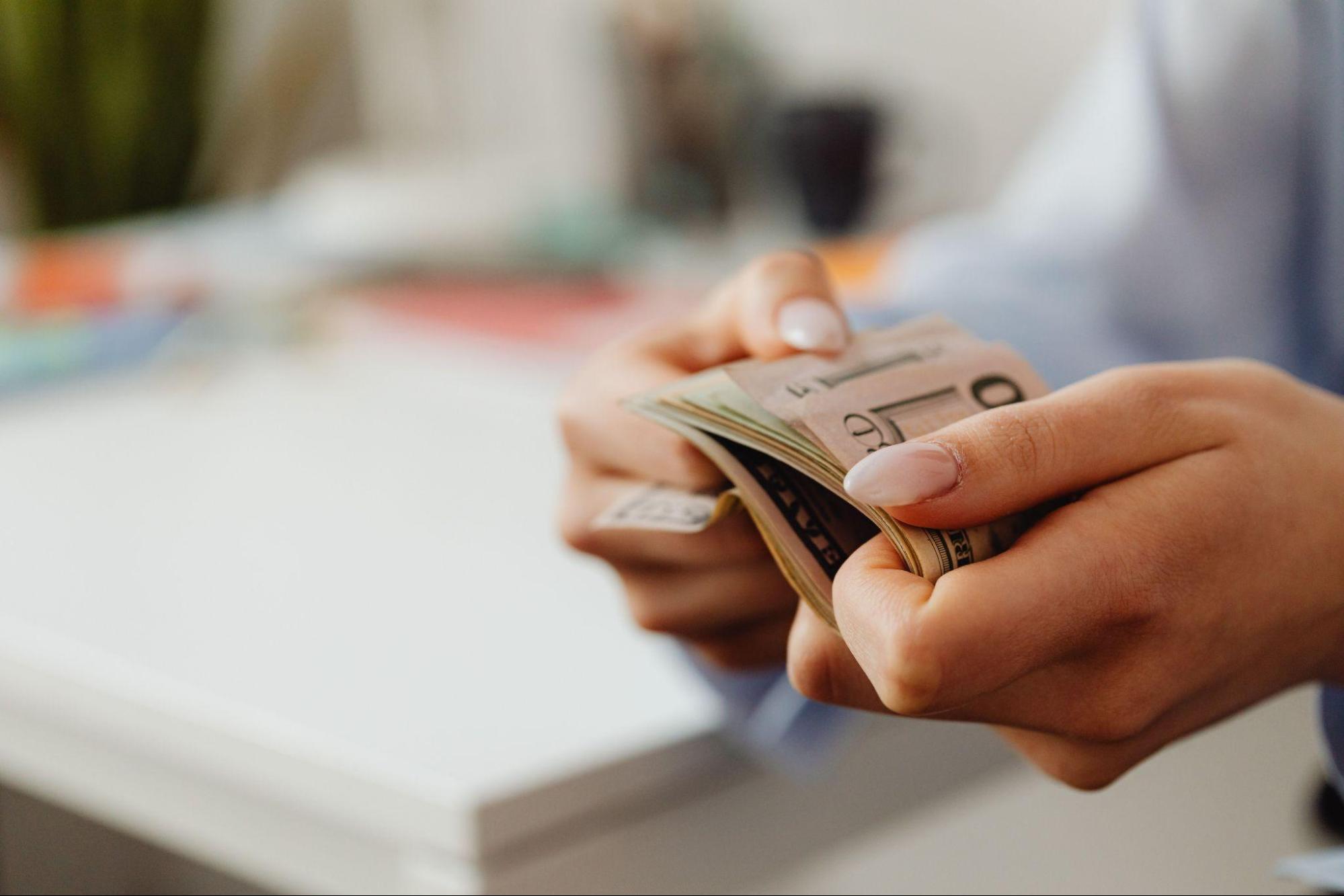 Person holding paper money