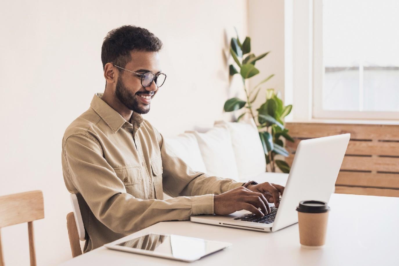 Freelancer working on a laptop while planning a workation